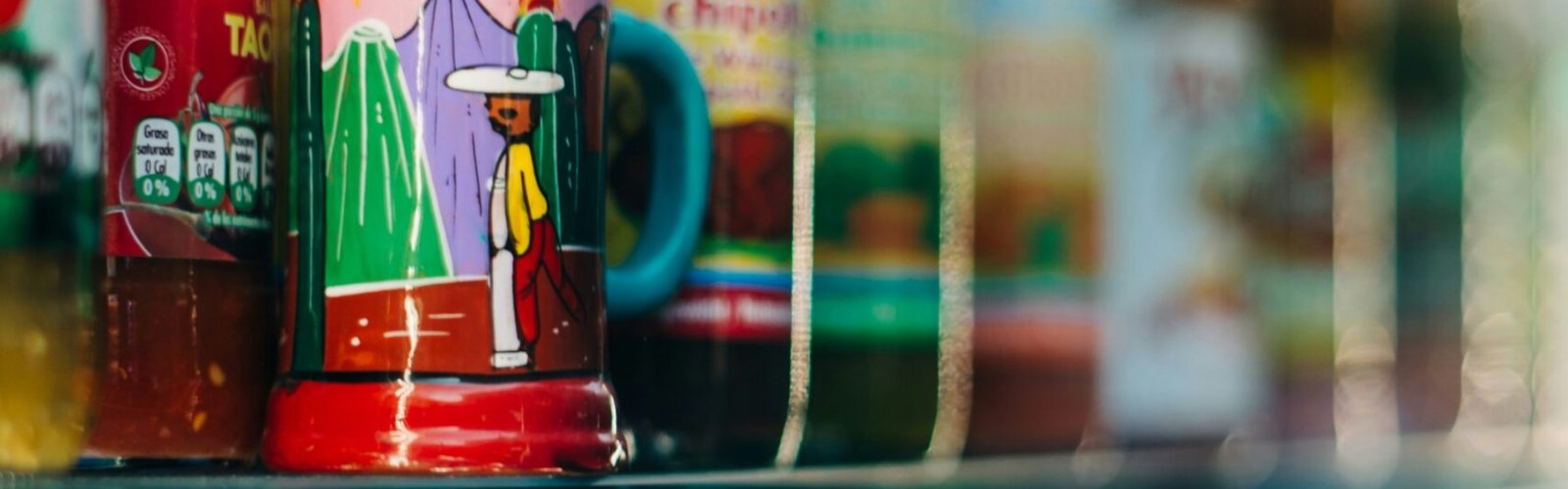 glass bottles on shelf with bottles